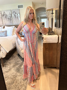 One of our top selling dresses is back!  You will receive endless compliments in this timeless beautiful boho dress.  It's perfect for spring, summer or warm fall days .  It's lightweight, colorful, fun and sexy with a plunge neckline and open back. Multi-color print in Barbie pink, royal blue and white. Made by Karma Highway.   ONE SIZE FITS MOST.