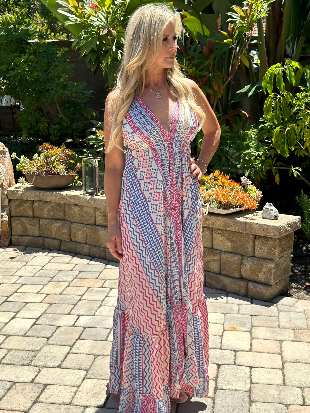One of our top selling dresses is back!  You will receive endless compliments in this timeless beautiful boho dress.  It's perfect for spring, summer or warm fall days .  It's lightweight, colorful, fun and sexy with a plunge neckline and open back. Multi-color print in Barbie pink, royal blue and white. Made by Karma Highway.   ONE SIZE FITS MOST.